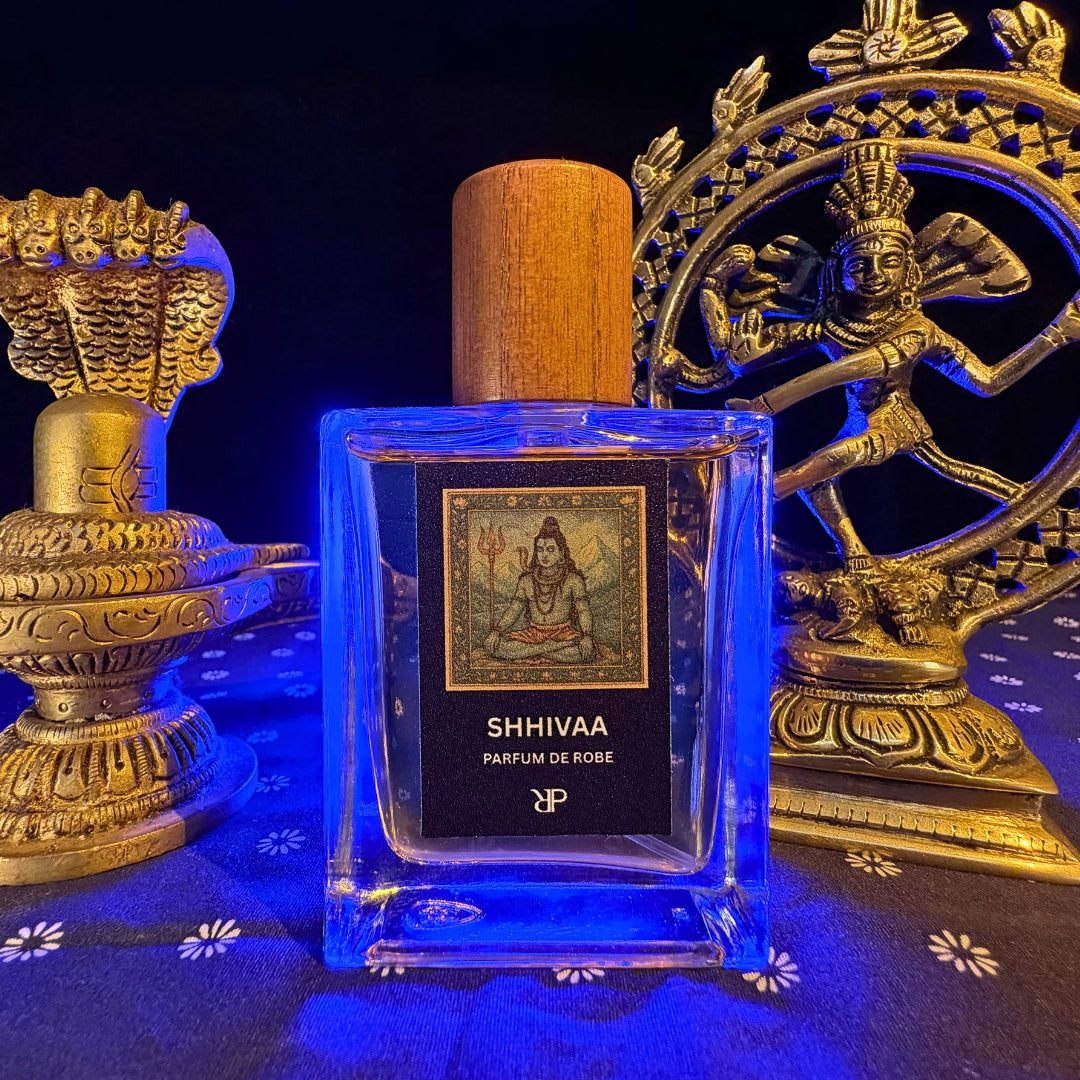 Perfume bottle labeled 'SHHIVAA' with decorative background